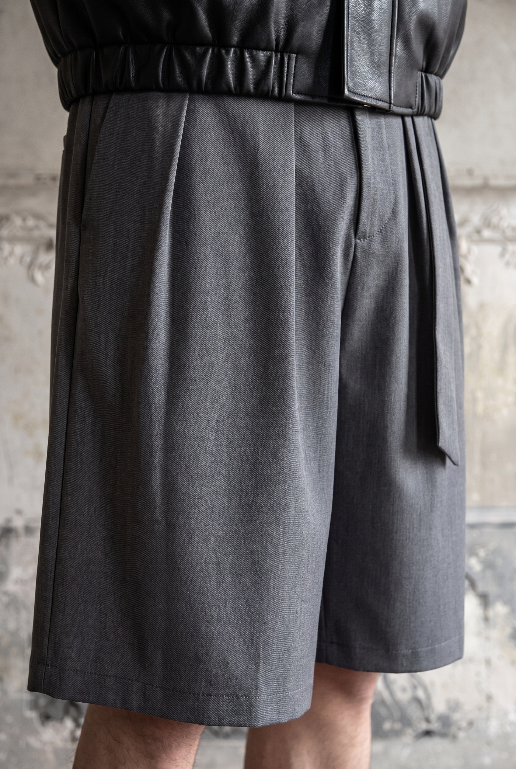 Leather Blouson and Pleated Shorts: shorts detail