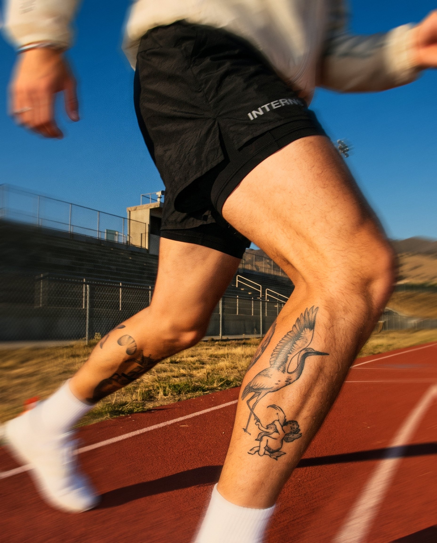 Padded Hooded Jacket and 2-in-1 Shorts: stride detail